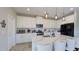 Bright kitchen featuring white cabinets, stainless steel appliances, and quartz countertops at 12661 Oak Hill Way, Parrish, FL 34219