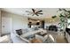 Open-concept living room and dining room with modern furnishings and decor at 12661 Oak Hill Way, Parrish, FL 34219