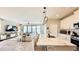 Modern, open living space showcasing a kitchen island, living area, and seamless flow for entertaining at 12661 Oak Hill Way, Parrish, FL 34219
