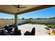 Covered back patio includes pavers, seating, and a peaceful view at 12661 Oak Hill Way, Parrish, FL 34219