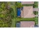 Aerial view of a luxury home with pool and landscaped yard at 13107 Belknap Pl, Bradenton, FL 34211