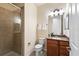 Small bathroom with shower and granite vanity at 13107 Belknap Pl, Lakewood Ranch, FL 34211