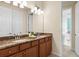 Double vanity bathroom with granite countertop at 13107 Belknap Pl, Lakewood Ranch, FL 34211