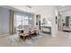 Formal dining room with a rustic wooden table and upholstered chairs at 13107 Belknap Pl, Lakewood Ranch, FL 34211
