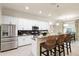 Modern kitchen with stainless steel appliances and granite countertops at 13107 Belknap Pl, Lakewood Ranch, FL 34211