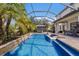 Inviting swimming pool with a spa and screened enclosure at 13107 Belknap Pl, Lakewood Ranch, FL 34211