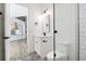 Modern bathroom with white vanity, hexagon tile shower, and patterned floor at 2318 Bay St, Sarasota, FL 34237
