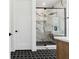 Modern bathroom with marble shower and hexagon floor tiles at 2318 Bay St, Sarasota, FL 34237