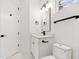 Small bathroom with white vanity and hexagon tile floor at 2318 Bay St, Sarasota, FL 34237