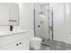 Stylish bathroom with black and white tile and modern vanity at 2318 Bay St, Sarasota, FL 34237