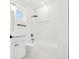 Clean bathroom with white subway tile, a bathtub, and a white vanity at 2318 Bay St, Sarasota, FL 34237
