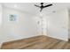 Bright bedroom with hardwood floors and ceiling fan at 2318 Bay St, Sarasota, FL 34237