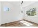 Bright bedroom with hardwood floors and large windows at 2318 Bay St, Sarasota, FL 34237