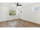 Spacious bedroom with hardwood floors and large window at 2318 Bay St, Sarasota, FL 34237