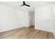 Spacious bedroom with hardwood floors and ceiling fan at 2318 Bay St, Sarasota, FL 34237
