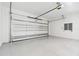 Spacious garage with an automatic garage door and epoxy flooring at 2318 Bay St, Sarasota, FL 34237