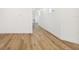 Light hallway with hardwood floors leading to other rooms at 2318 Bay St, Sarasota, FL 34237