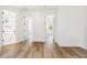 Bright hallway with hardwood floors and access to bedrooms and bathroom at 2318 Bay St, Sarasota, FL 34237