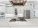 Modern kitchen with white cabinets, stainless steel appliances, and quartz countertops at 2318 Bay St, Sarasota, FL 34237