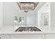 Modern kitchen with white cabinets, quartz countertops, and a gas cooktop at 2318 Bay St, Sarasota, FL 34237