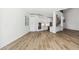 Open living room with hardwood floors and kitchen view at 2318 Bay St, Sarasota, FL 34237