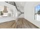 Bright living room with hardwood floors, high ceilings and modern staircase at 2318 Bay St, Sarasota, FL 34237