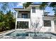 Two-story home with a backyard pool and patio at 2318 Bay St, Sarasota, FL 34237