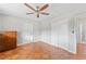 Bedroom with terracotta floor, ceiling fan, and ample closet space at 1841 Buccaneer Dr, Sarasota, FL 34231