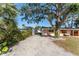 Ranch house with driveway and lush landscaping at 1841 Buccaneer Dr, Sarasota, FL 34231