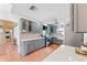 Modern kitchen features gray cabinets, quartz countertops, and terracotta tile floors at 1841 Buccaneer Dr, Sarasota, FL 34231