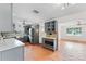 Modern kitchen with gray cabinets and marble countertops at 1841 Buccaneer Dr, Sarasota, FL 34231