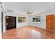 Living room with terracotta floors and built-in shelving at 1841 Buccaneer Dr, Sarasota, FL 34231