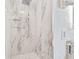Large walk-in shower with marble tile and rain shower head at 1841 Buccaneer Dr, Sarasota, FL 34231