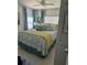 Spacious bedroom with coastal bedding and light wood floors at 808 53Rd E Ave # 8, Bradenton, FL 34203