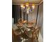 Charming dining area with a glass table and wicker chairs at 808 53Rd E Ave # 8, Bradenton, FL 34203