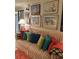 Living room with striped sofa and coastal-themed artwork at 808 53Rd E Ave # 8, Bradenton, FL 34203