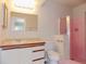 Bathroom with a shower, toilet, and a large mirror at 6555 Connecticut Ave, Sarasota, FL 34243