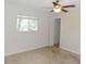 Bedroom with neutral carpet, and a ceiling fan and window at 6555 Connecticut Ave, Sarasota, FL 34243