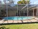 Enjoy a private pool with a screened enclosure in this home, perfect for relaxation and entertainment at 6555 Connecticut Ave, Sarasota, FL 34243