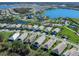 Community overview featuring a house with a screened enclosure at 7996 Sandstar Way, Sarasota, FL 34240