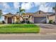 Two-story house with attached garage and manicured lawn at 1259 Tyne Ln, Bradenton, FL 34208