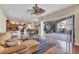 Open living space with a view of the kitchen, dining area, and screened lanai with patio furniture at 2921 Seasons Blvd, Sarasota, FL 34240