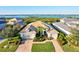Luxury waterfront home with landscaped yard and two-car garage at 5130 Tidewater Preserve Blvd, Bradenton, FL 34208