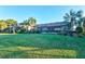 Landscaped backyard with lush lawn and pool enclosure at 5130 Tidewater Preserve Blvd, Bradenton, FL 34208
