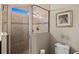 Bathroom featuring a shower stall, toilet and decorative wall art at 5130 Tidewater Preserve Blvd, Bradenton, FL 34208