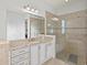 Bathroom with vanity, shower, and granite countertop at 5130 Tidewater Preserve Blvd, Bradenton, FL 34208