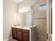Bathroom with a vanity, large mirror, and a walk-in shower at 5130 Tidewater Preserve Blvd, Bradenton, FL 34208