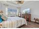 Spacious bedroom with water views, large windows, and wood dresser at 5130 Tidewater Preserve Blvd, Bradenton, FL 34208