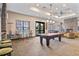 Relaxing clubhouse with a billiard table and fireplace at 5130 Tidewater Preserve Blvd, Bradenton, FL 34208