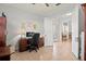 Bright home office with built-in shelving and a large desk at 5130 Tidewater Preserve Blvd, Bradenton, FL 34208